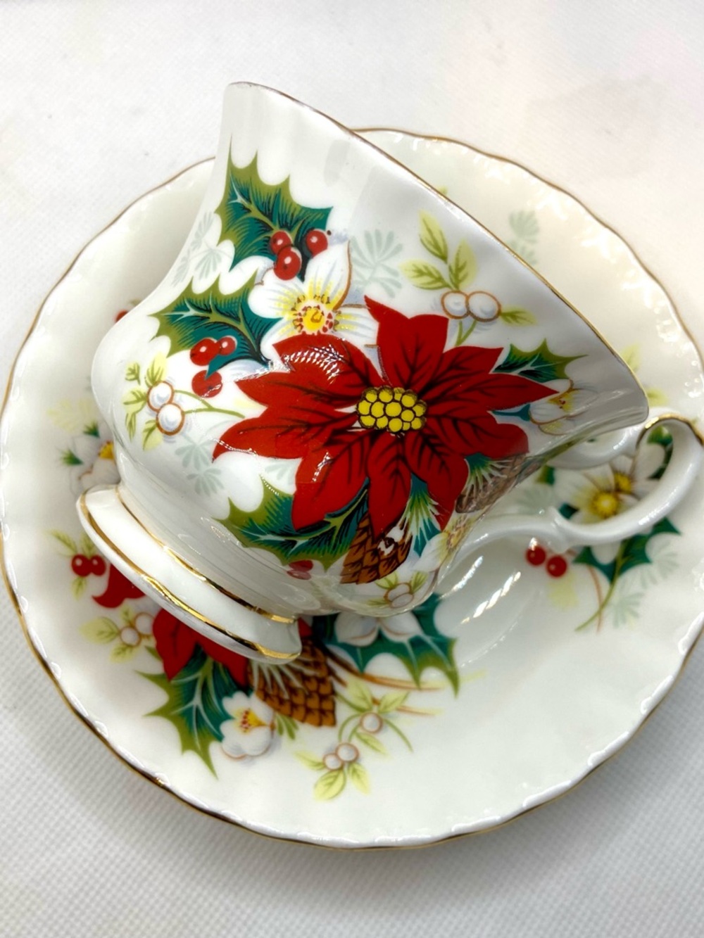 Royal Albert Poinsettia Teacup and Saucer in Red, Green and Gold